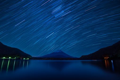 Star trails over Mount Fuji on a clear night from lake Shoji, Yamanashi Prefecture, Japan