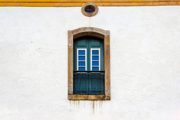Old and classic wood window on a white wall