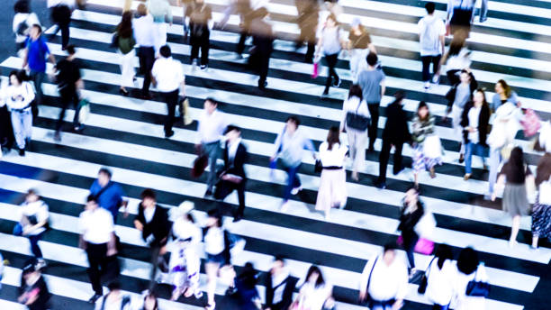 istock People walking at the crosswalk at Tokyo intersection 1200943930