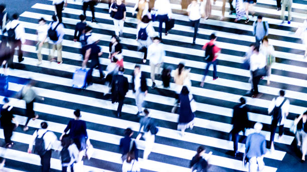 istock People walking at the crosswalk at Tokyo intersection 1200943967