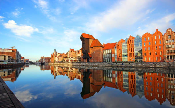 Old town of Gdansk reflected in Motlawa river at sunrise, Poland. stock photo