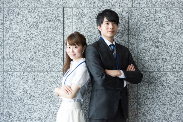 Business image, man and woman with folded arms Business image, man and woman with folded arms image. only japanese stock pictures, royalty-free photos & images