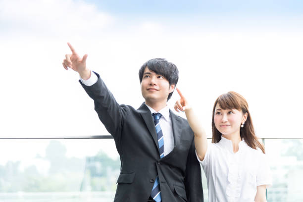 ビジネス、男性と女性、指差し - 努力 ストックフォトと画像