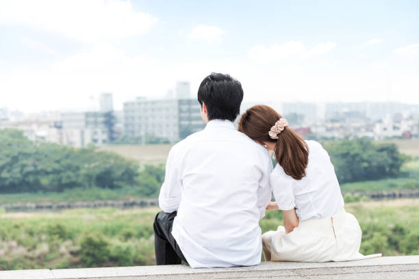 istock Couple cuddling outdoors with beautiful scenery 1200946511