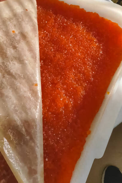 red caviar in plastic container. salmon caviar, diet food. - plank bread caviar close up imagens e fotografias de stock