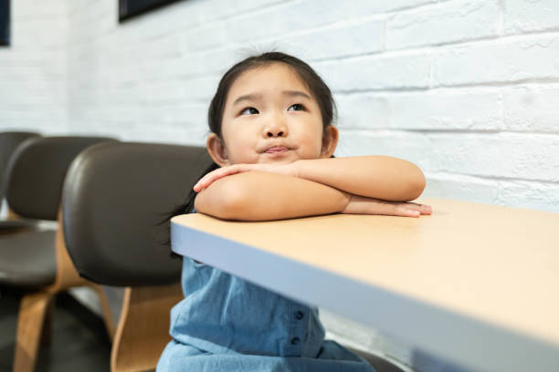 istock Smiling girl in the restaurant 1200947450