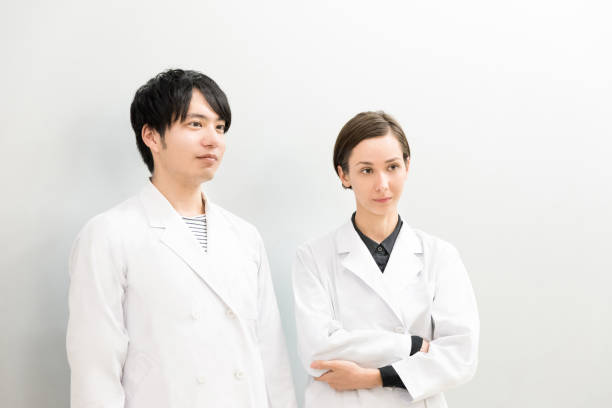 istock Foreign men and women in white coats (doctors, scientists, scholars) 1200948592