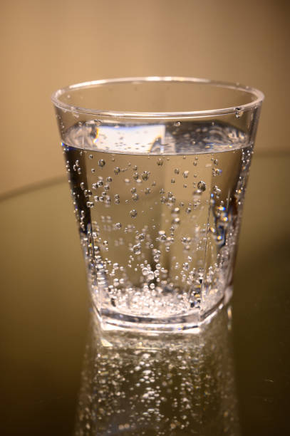 istock Plastic transparent glass with sparkling water with bubbles 1200949192