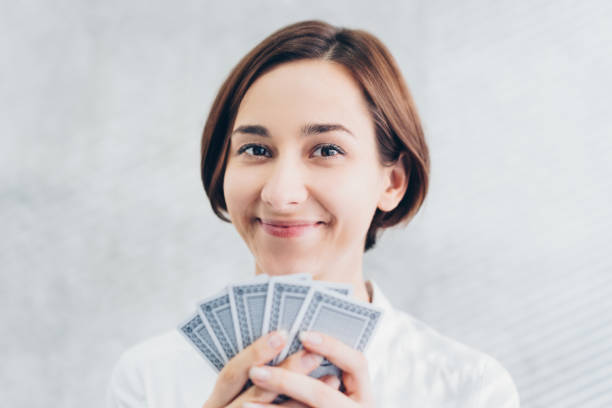 istock Woman choosing a card 1200950259