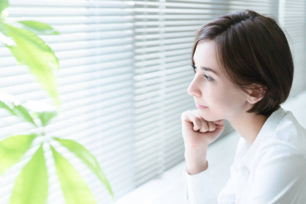 Woman looking out of window