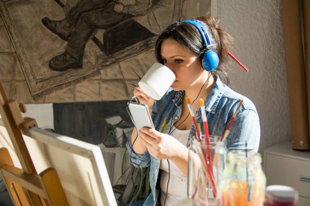 istock Enjoying in coffee while taking a break from painting 1200951368