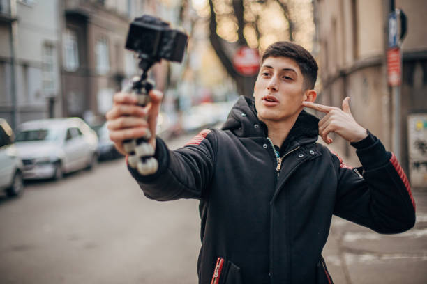 istock Teenager is filming vlog 1200951382
