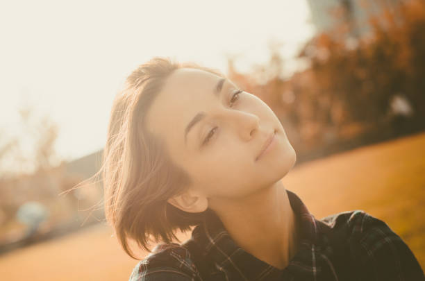 istock Woman relaxing in the park 1200951399