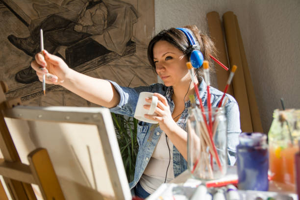 istock Beautiful female artist measuring object 1200951501
