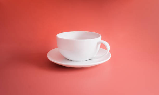 istock White coffee cup isolated on orange pastel background or orange backdrop 1200951694