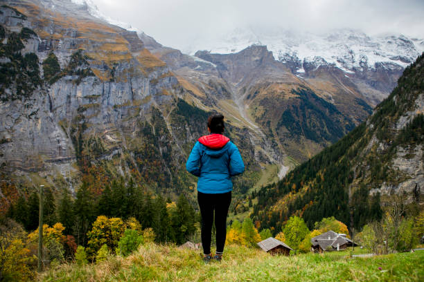 autumn season, young woman hiking  and take a rest in murren, Swiss