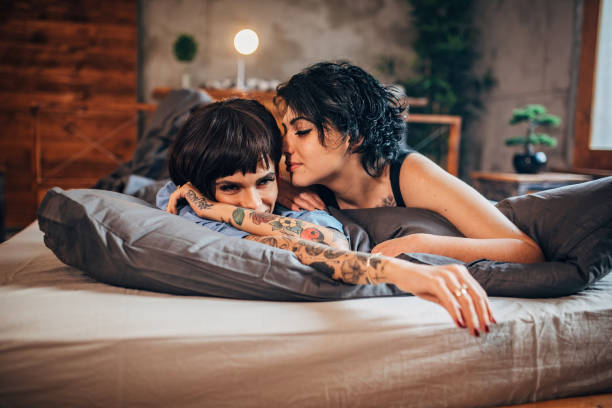 istock Pretty couple laying in bed 1200956243