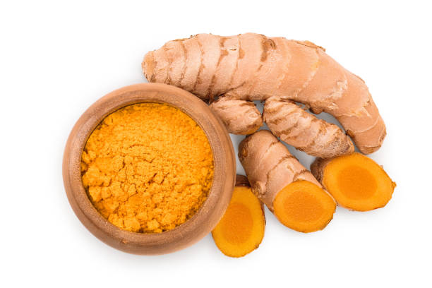 istock Turmeric powder and turmeric root isolated on white background. Top view. Flat lay 1200958034