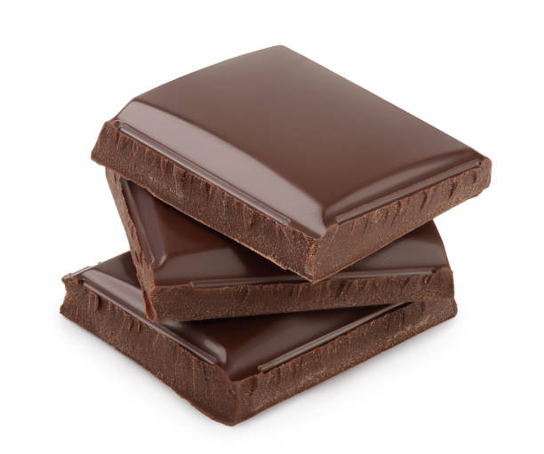 istock Small dark chocolate pieces isolated on white background with clipping path 1200958080
