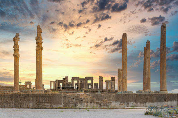 Panoramic overview of ruins of the ancient city Persepolis, Iran.  Persepolis (Old Persian: Pārśa; Modern Persian: Pārse) was the ceremonial capital of the Achaemenid Empire (ca. 550–330 BC). The site is situated 60 km northeast of the city of Shiraz in Fars Province, Iran. The earliest remains of Persepolis date back to 515 BC. It exemplifies the Achaemenidic style of architecture and is an UNESCO World Heritage Site.SHOT FROM OUTSIDE THE VENUE, no protected/ticketed/forbidden area.