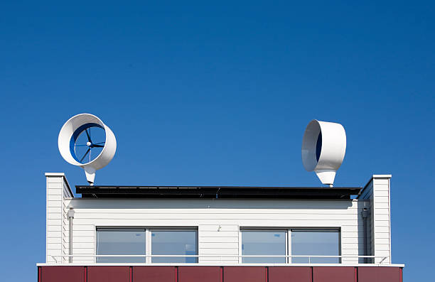 Residential wind turbines Residential wind turbine on a house in Almere, the Netherlands almere photos stock pictures, royalty-free photos & images