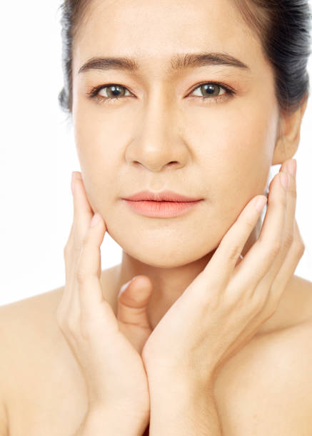 istock Young asian woman clean fresh skin on white background 1200961987