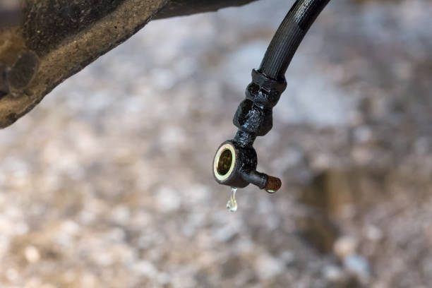 Brake line hose with dripping brake fluid