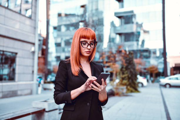 istock Elegant Female Passing Time With Smartphone While Waiting 1200963942
