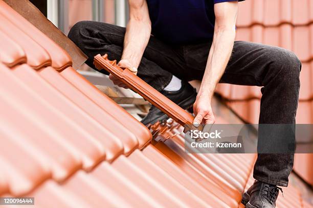 Tiler Covering Roof With New Tile Stock Photo - Download Image Now - Rooftop, Repairing, Roof Tile