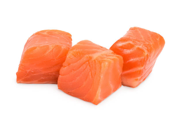 istock raw salmon piece cube isolated on white background close up 1200966753