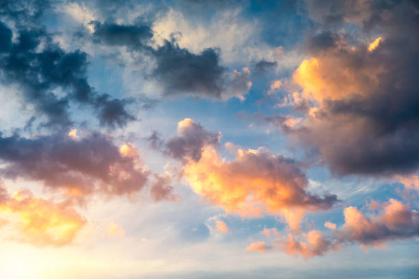 istock Beautiful sunset sky above clouds with dramatic light. Sunset sky for background, sunrise sky and clouds. Bright orange and blue sky and light of the sun. Beautiful sky with cloud before sunset. 1200967408