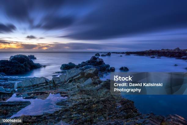 Twilight Begins Yielding To Daylight At Rocky Coastline Stock Photo - Download Image Now