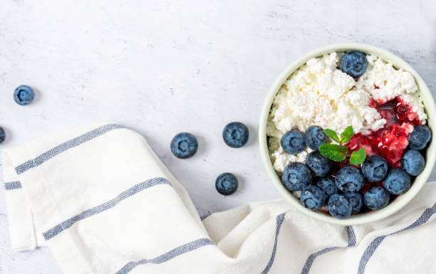 istock Cottage cheese with jam and fresh blueberries 1200968974