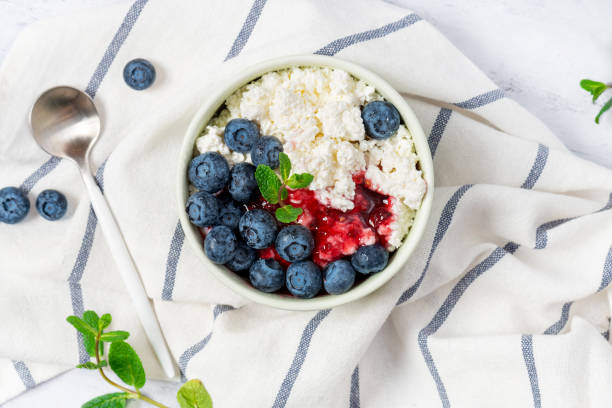 istock Cottage cheese with jam and fresh blueberries 1200969236