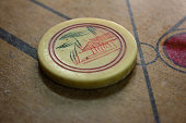 istock View of stricker used in carrom board game. Multiplayer board game with good fun time. 1200969237