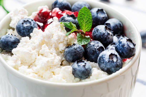 istock Cottage cheese with jam and fresh blueberries 1200969252