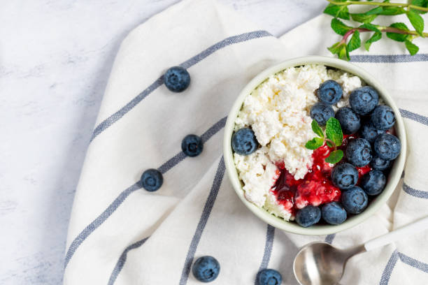 istock Cottage cheese with jam and fresh blueberries 1200969282
