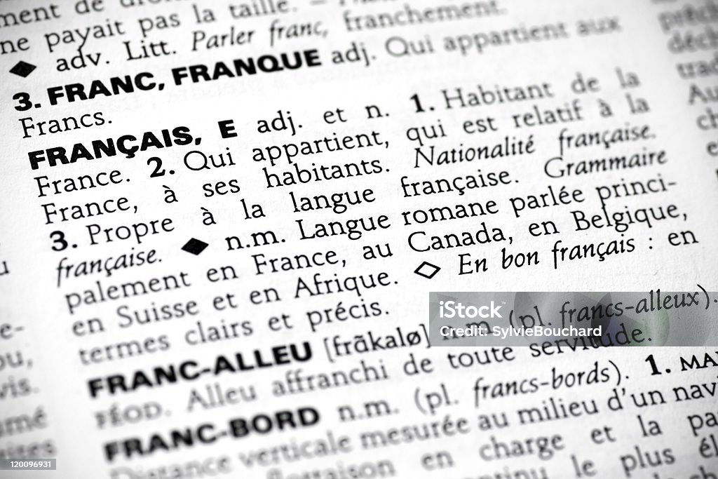 Français in the dictionary Macro shot with focus on the word français and its definition in a french dictionary. Dictionary Stock Photo