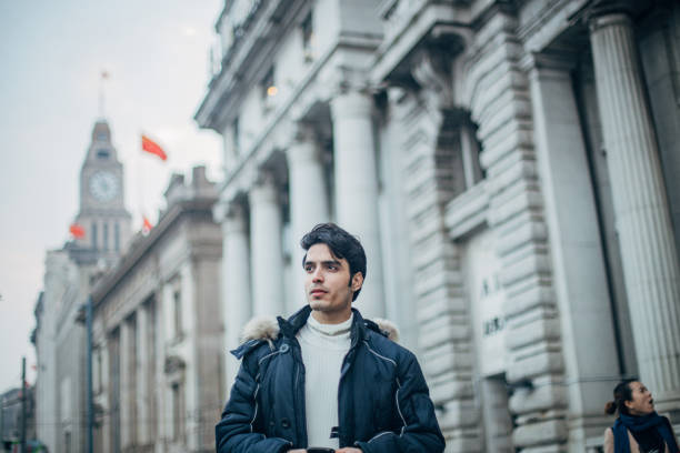 istock Handsome guy walking on the street 1200969837
