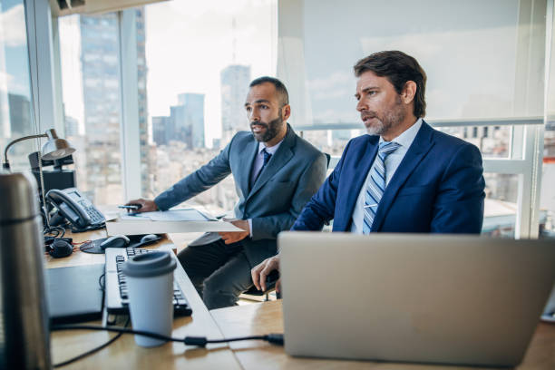 istock Businessmen working together in the office 1200970997
