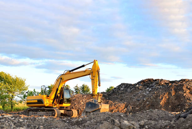 istock Excavator with crusher bucket for crushing concrete. 1200972398