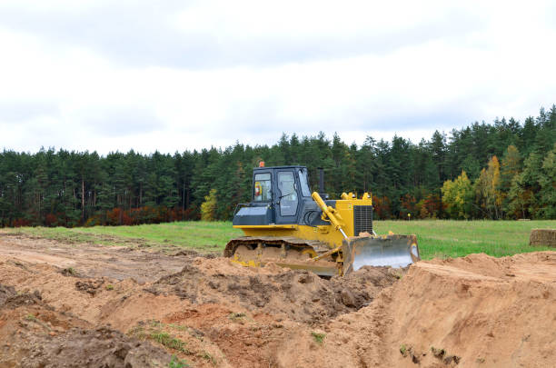 istock Bulldozer during land clearing and foundation digging at large construction site. 1200972538