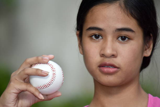 istock Serious Sporty Minority Athlete With Baseball 1200973672