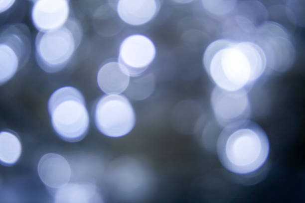 istock Blurred lights dark gray blue background. Abstract bokeh with soft light. Shiny festive texture 1200974996
