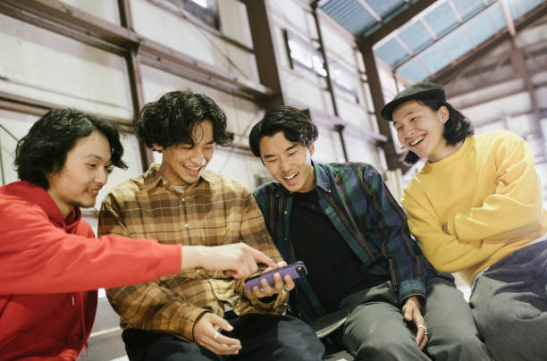 istock Friends watching skateboarding videos. 1200976489