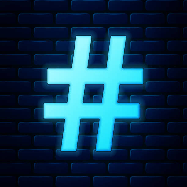 istock Glowing neon Hashtag icon isolated on brick wall background. Social media symbol. Modern UI website navigation. Vector Illustration 1200976864