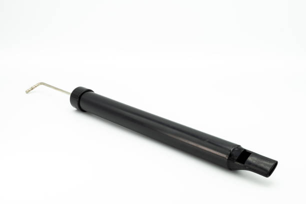 closeup of a black slide whistle - slide whistle imagens e fotografias de stock