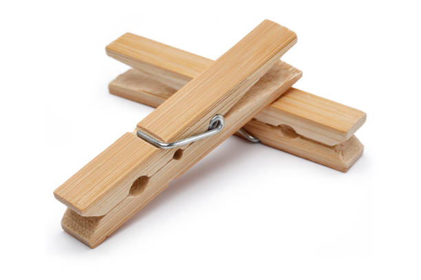 istock Wooden clothes peg isolated on white 1200977545