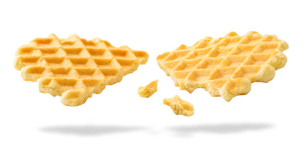 istock Waffle cookies are broken in half, close-up. Isolated 1200977593
