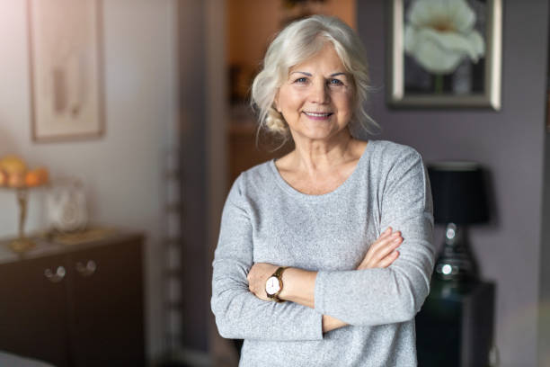 istock Smiling senior woman in her home 1200977923